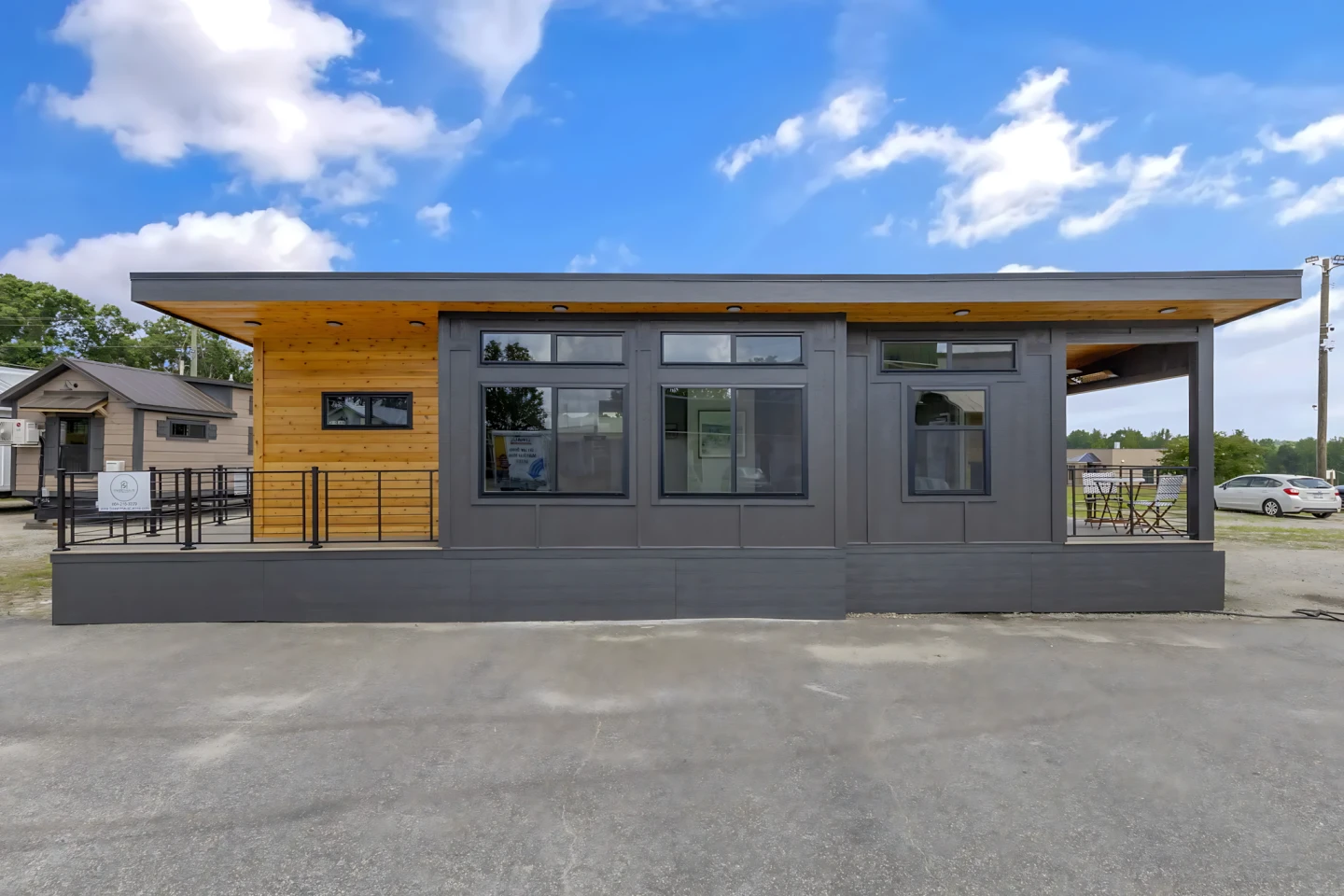 This tiny house doubles its square footage with two porches and no stairs