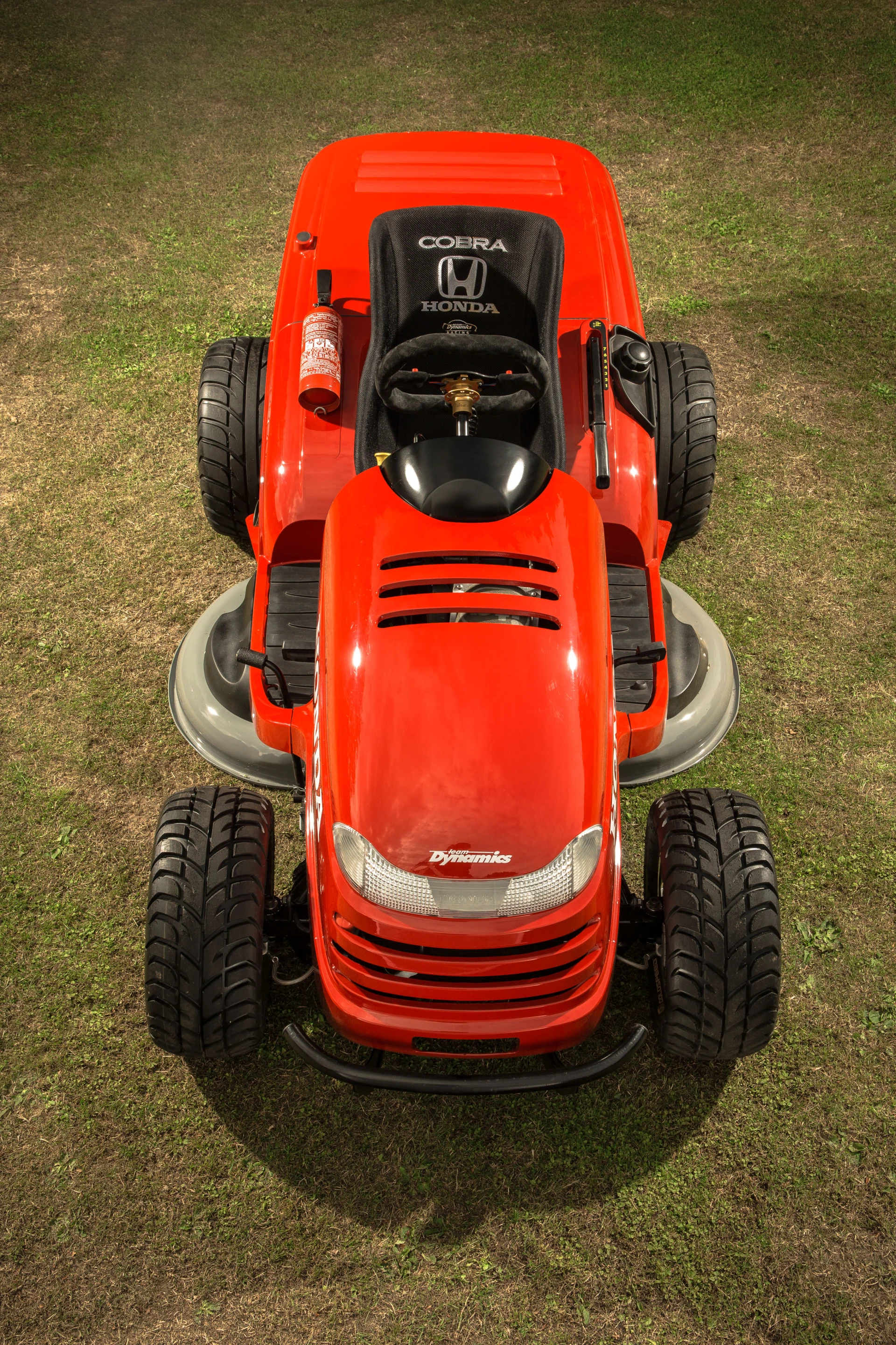 Mower features steering rack from a Morris Minor, custom suspension unit and performance ATV wheels
