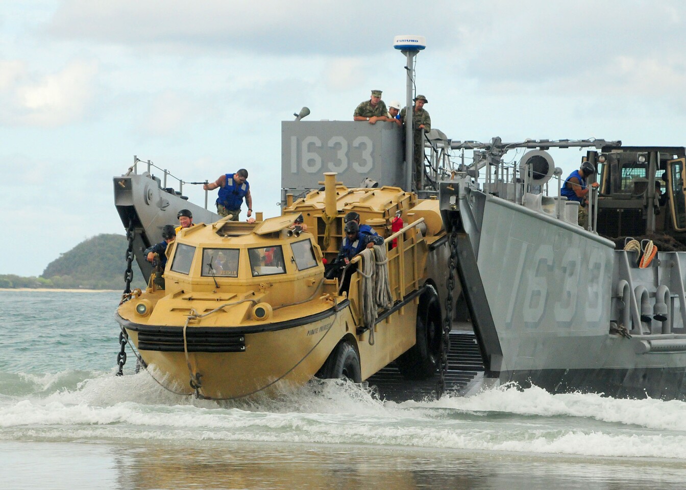 That's a LARC-V (Light Amphibious Resupply Cargo) backing onto a Landing Craft Utility (LCU) while participating in a humanitarian assistance and disaster response training exercise in Thailand. (Picture by Robert Clowney, U.S. Navy)