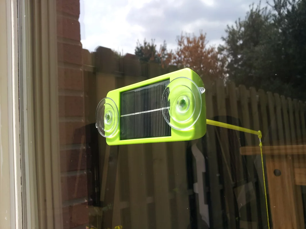 The Solar Chaser attaches to the glass via built-in suction cups