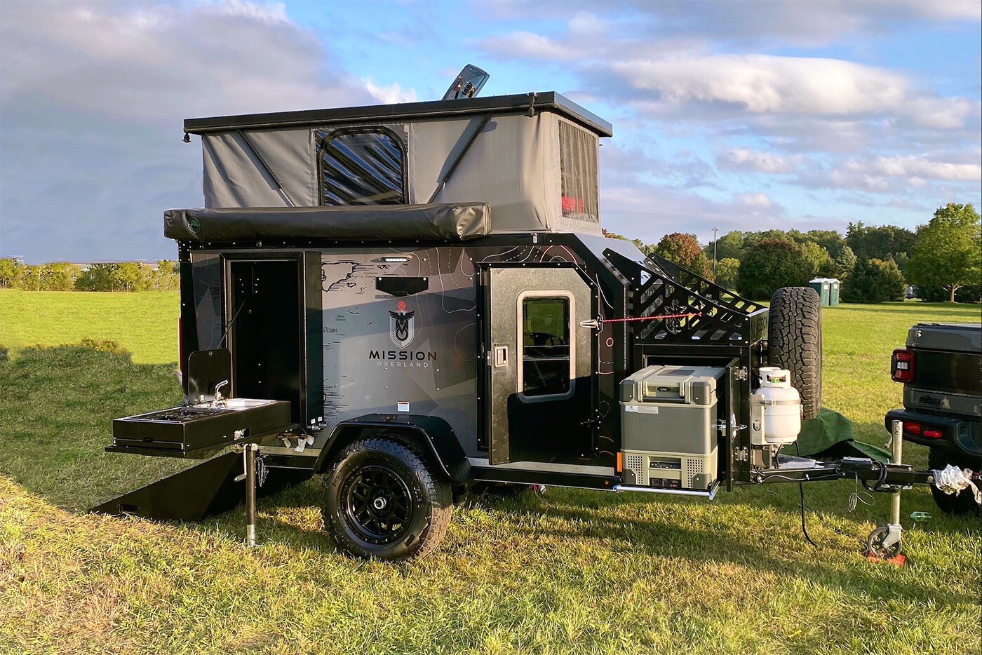 The Trail Dog has room for your ATVs and bikes, plenty of gear, plus a bed to sleep two above