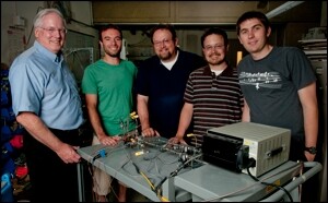 Prof. Brain Cantwell (left) with graduate students and a nitrous oxide decomposition cell