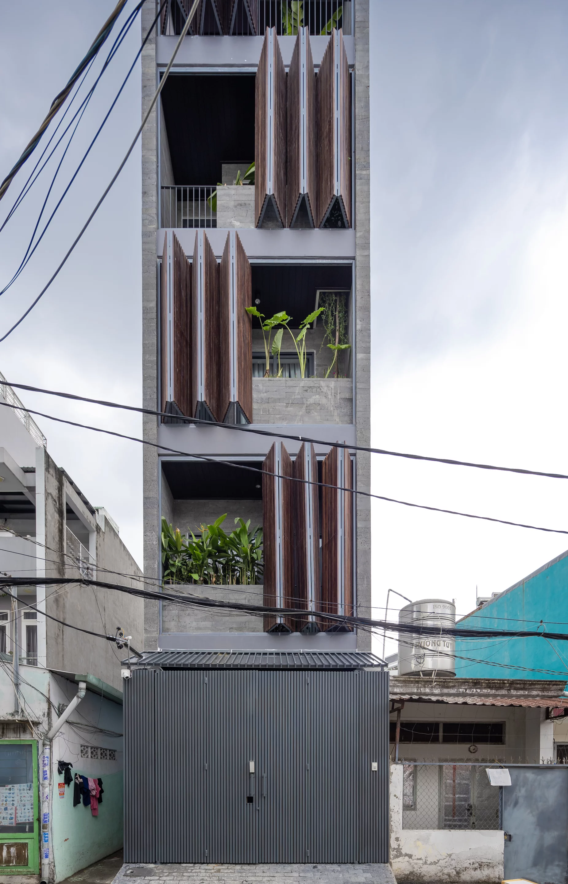 The Chic Vid House incorporates greenery on its multiple balcony areas