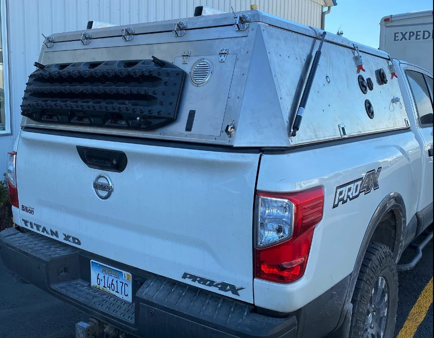 Many pickup toppers and campers sit well higher than the truck cab, but Skinny Guy has designed its camper to sit at roughly cab level in box form, no alcove or extension over top the driver area