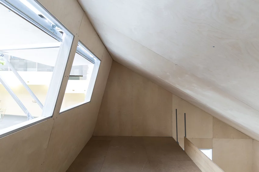 A mezzanine level provides sleeping space in the roof