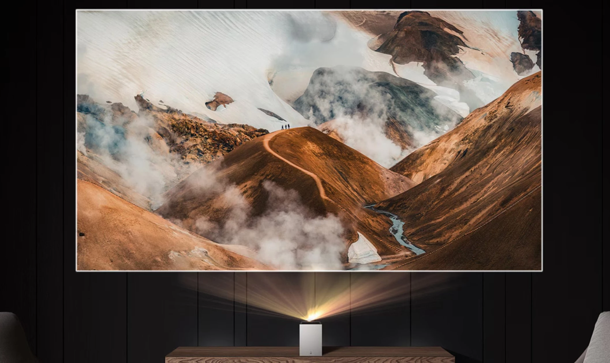 A compact and lightweight triple-laser projector for big-screen 4K visuals while sitting inches from a wall