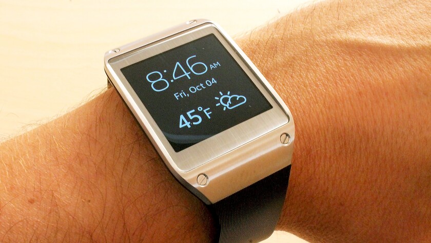 The Gear's screen turns on (usually) when you lift your wrist