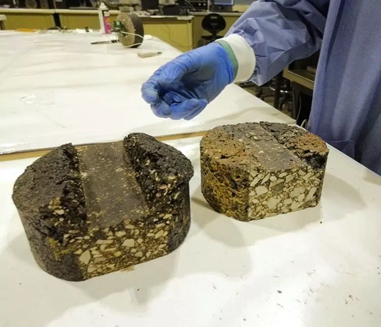 Chunks of asphalt made with binders derived from pig manure, which can replace the petroleum found in traditional asphalt