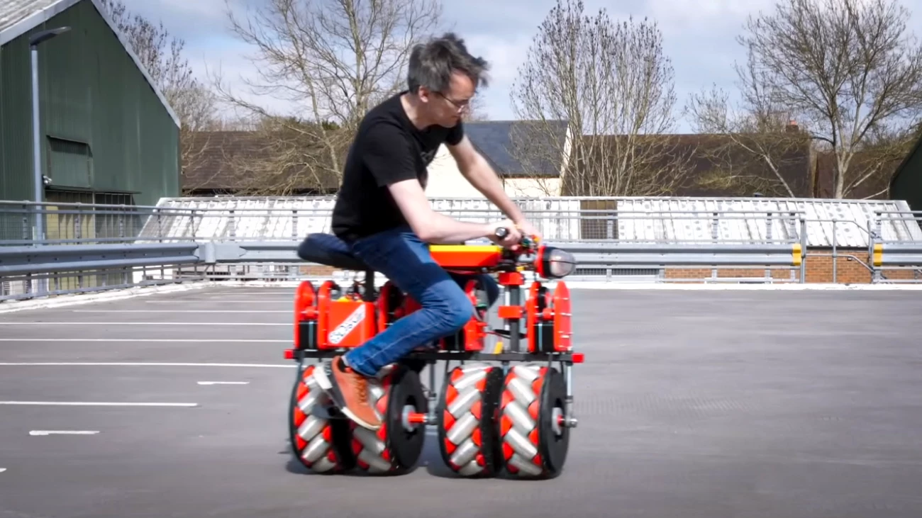 YouTuber James Bruton rides his bizarre, self-balancing, omnidirectional "Screw Bike"