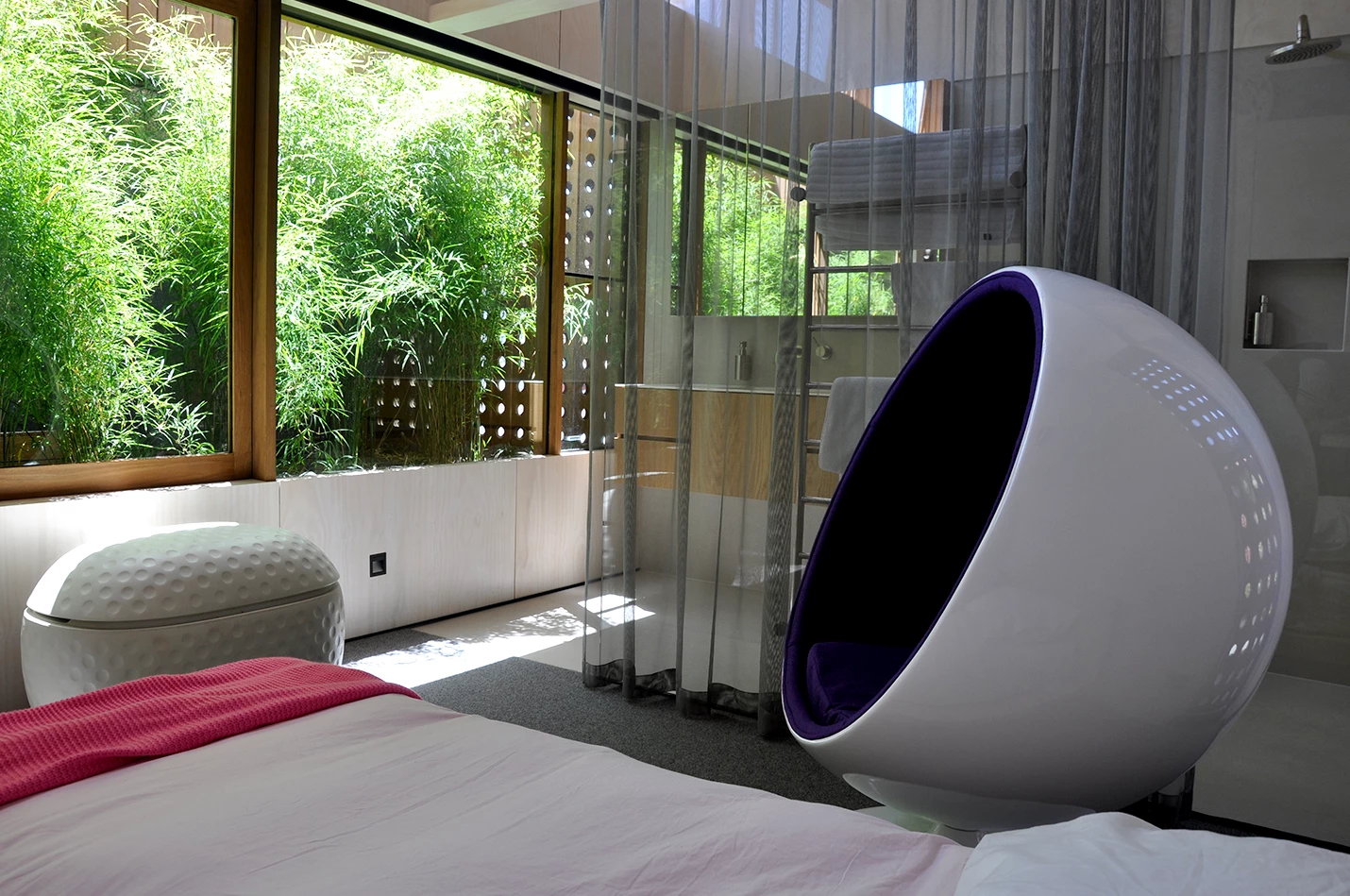 The bedroom includes an en-suite subtly separated by a metallic curtain (Photo: Edoardo Campanale for Gizmag)
