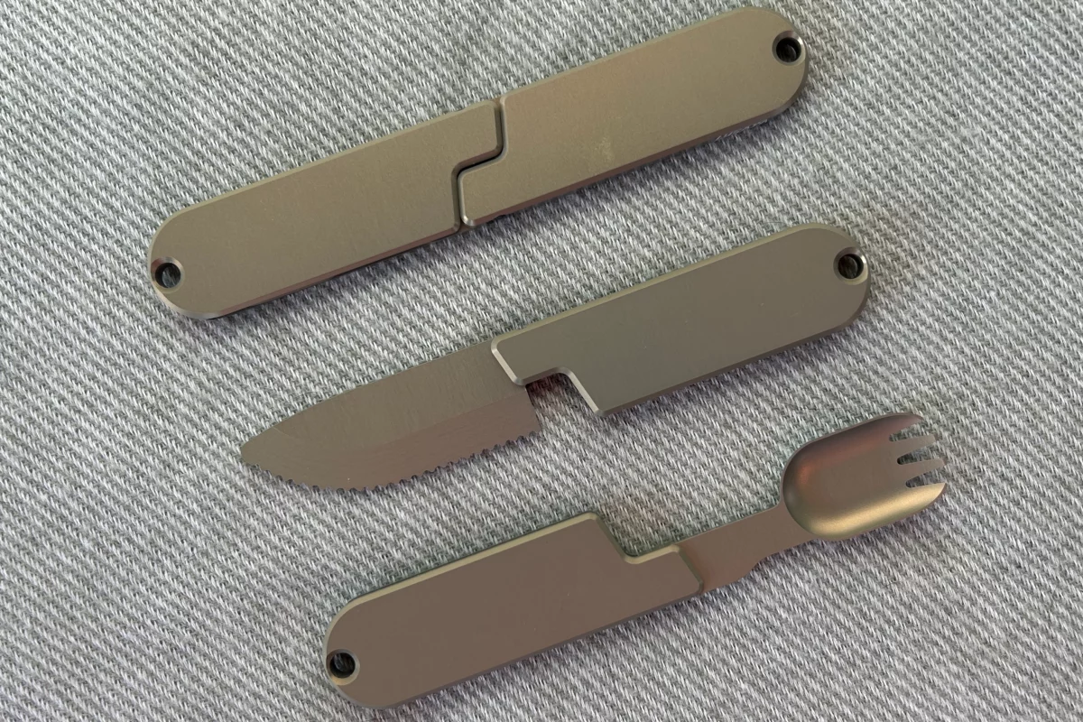 The Kopak Utensil Set consists of an aluminum knife and spork (middle, bottom) which magnetically nest together to form one oblong unit (top)