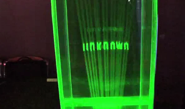 Green laser light creates a hovering word in True 3D(Image: DigInfo)