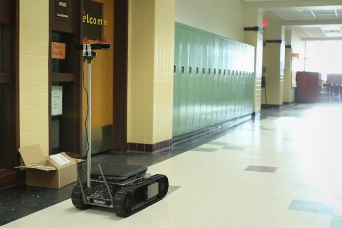 An iRobot PackBot navigates a school, in a demonstration of the Cognitive Patterns system