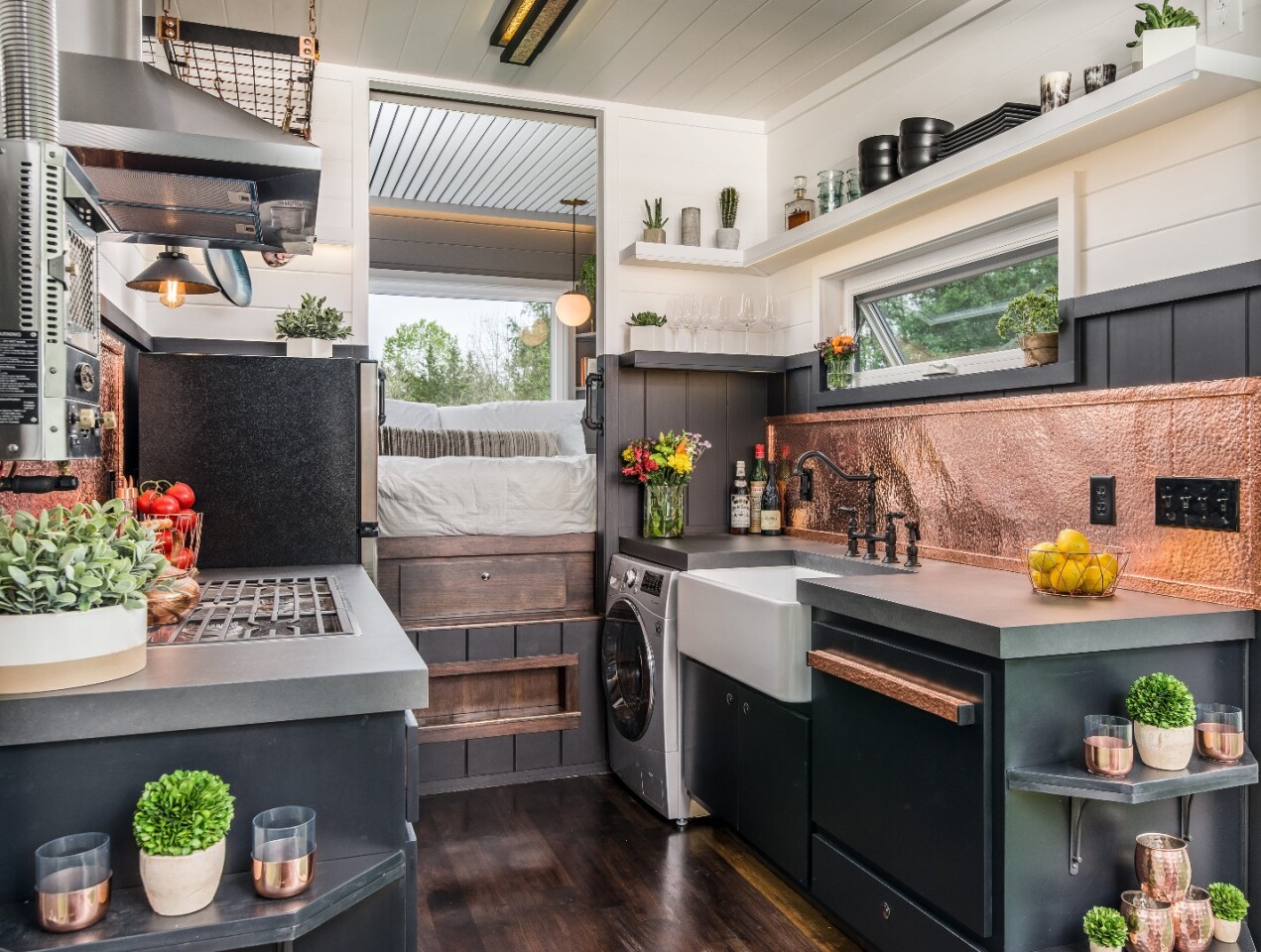 The Escher's kitchen looks really high end and includes porcelain countertops and copper detailing
