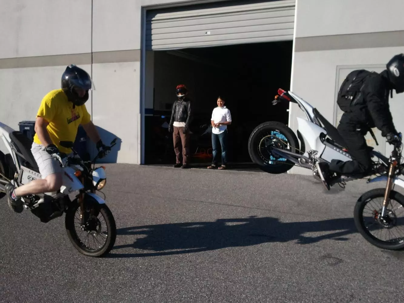 Fangin' stoppies on early electric bikes outside the Zero factory. That's Luke on the left.