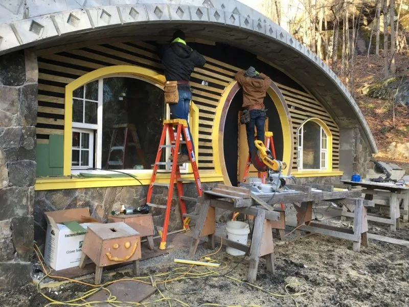 Structurally, Hobbit Hollow consists of two parallel 16 inch (40.64 cm)-thick concrete walls running the length of the house supporting a reinforced concrete tapered slab that's 16 inches thick over the walls and 9 inches (22.96 cm)-thick over the peak of the roof
