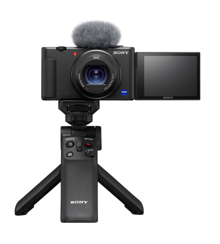 The wind muff is included; the shooting grip is a separate product