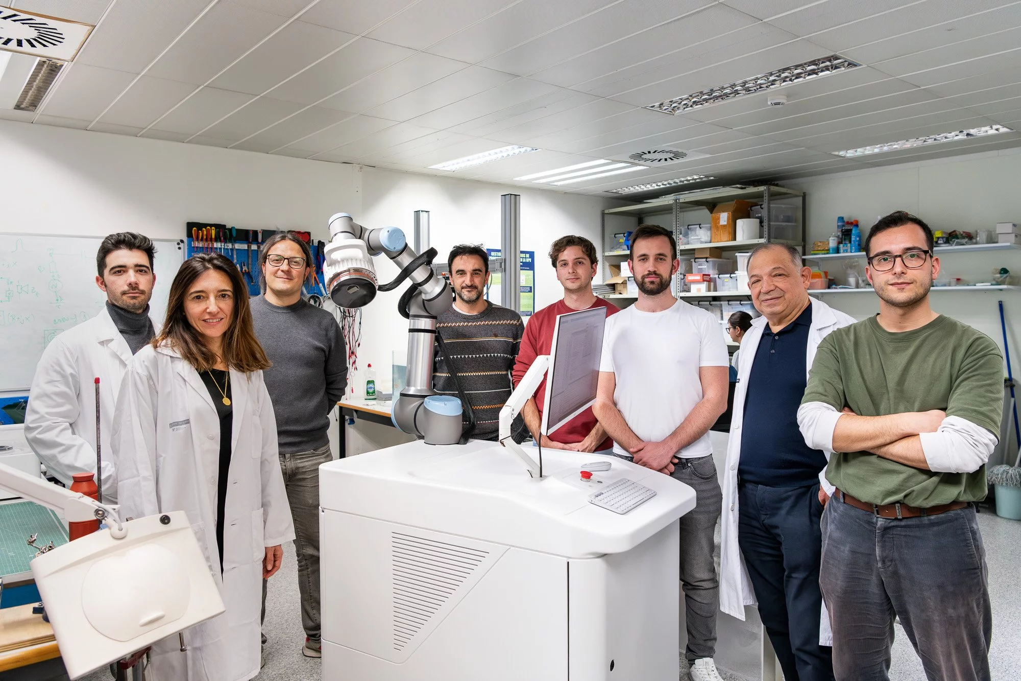 Members of the research team with the prototype Lithovortex machine