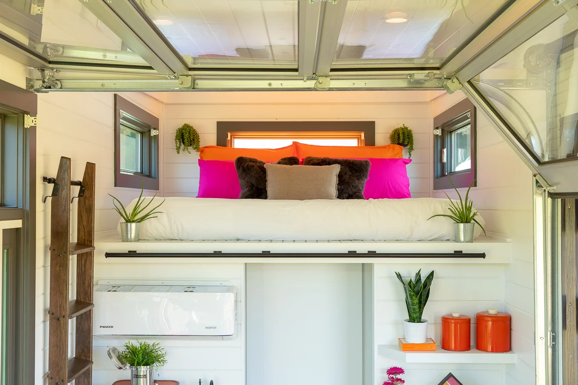 The Home That Runs on Dunkin's small sleeping loft includes a king-sized bed