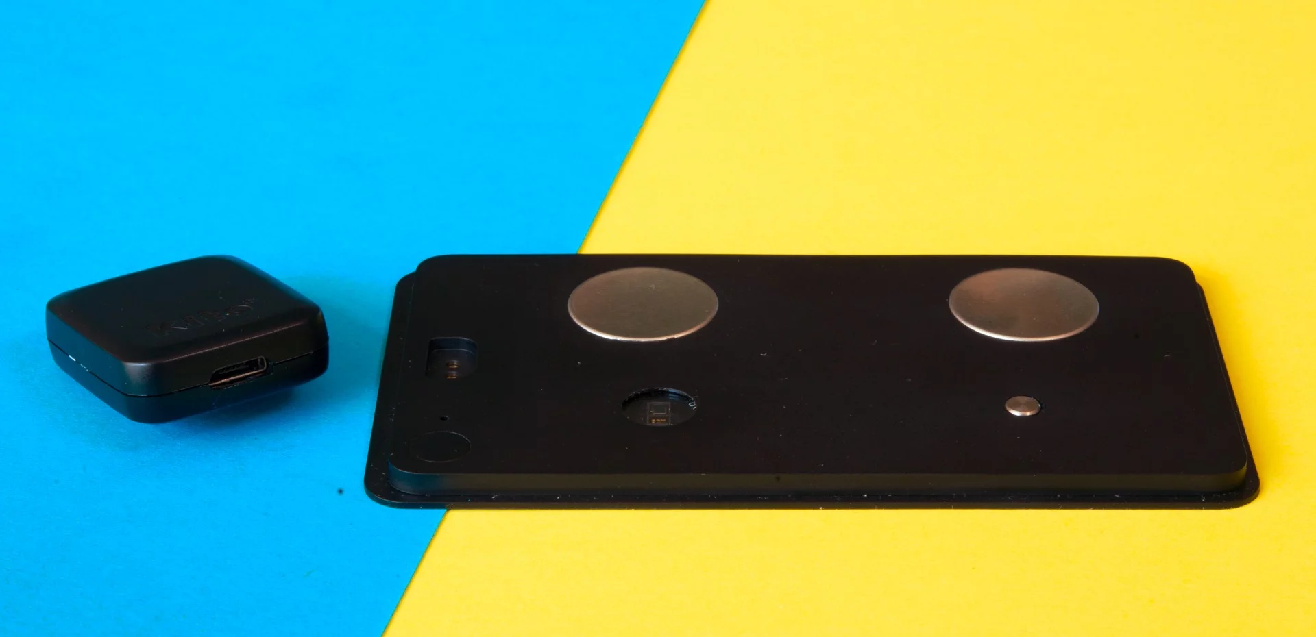 The Kito+ health tracker with the magnetic charger