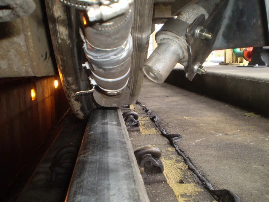 One of the Advanced Rail Cleaner's track-clearing nozzles points at the rail (Photo: GE Transportation)