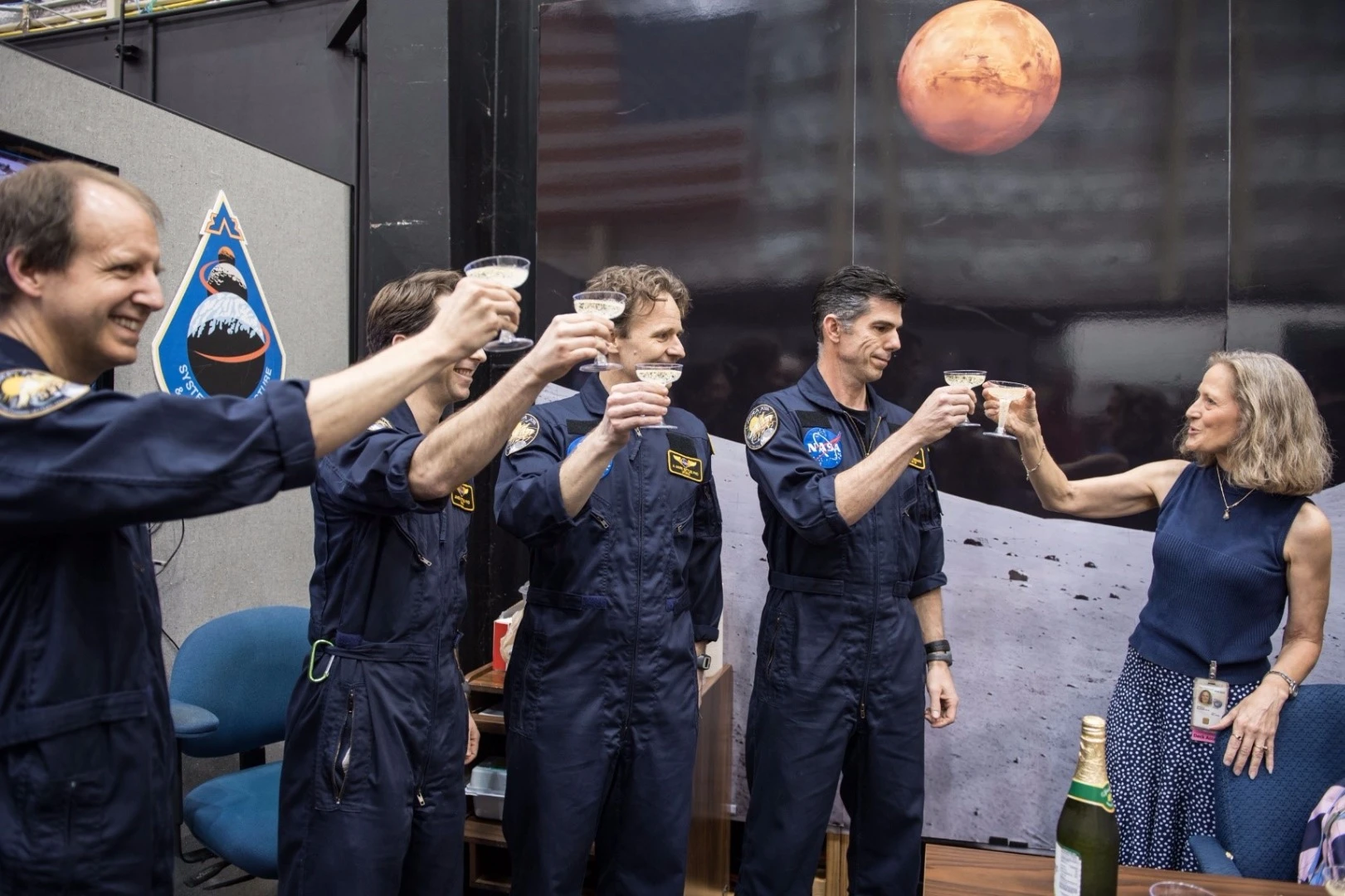 Flight Analog Program Manager, Lisa Spence, toasts the HERA XIII crew with sparkling grape juice