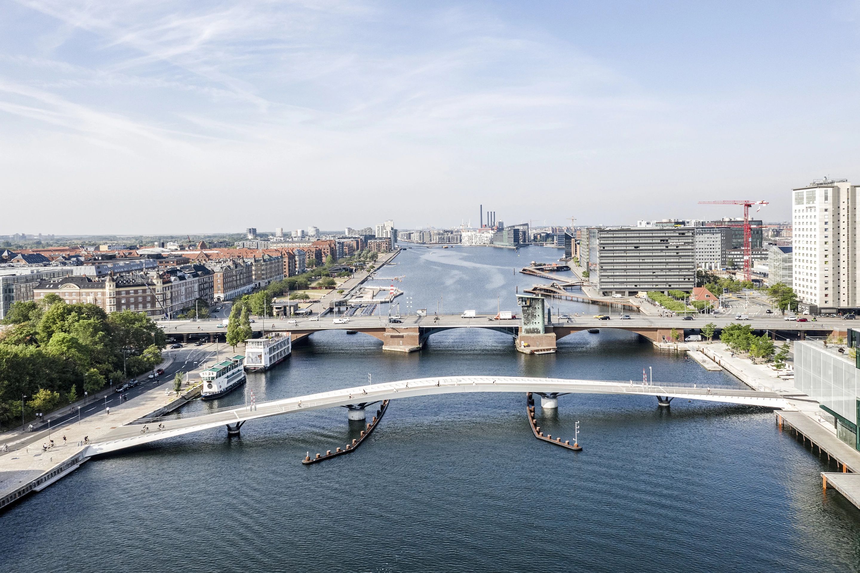 Lille Langebro was designed by WilkinsonEyre with Urban Agency and is located in Denmark. The project creates an elegant new cycle and pedestrian bridge in the city of Copenhagen