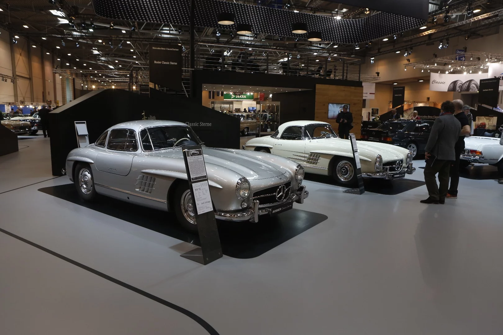 A Mercedes-Benz 300 SL Gullwing and Roadster on the stand of model specialist HK Engineering
