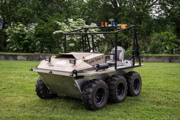The autonomous Land Tamer vehicle, which will be dropped off to explore a rugged area by a likewise-autonomous Black Hawk helicopter