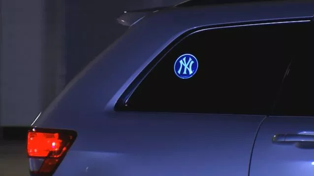 The Powerdecal displays backlit images through the window glass of a car