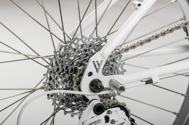 ... foot pegs for pushing the back of the frame into its folded position ...