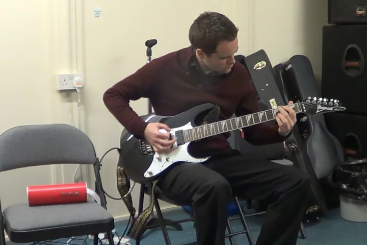 Amp in a Can is a portable guitar amplifier housed in recycled cardboard tubing