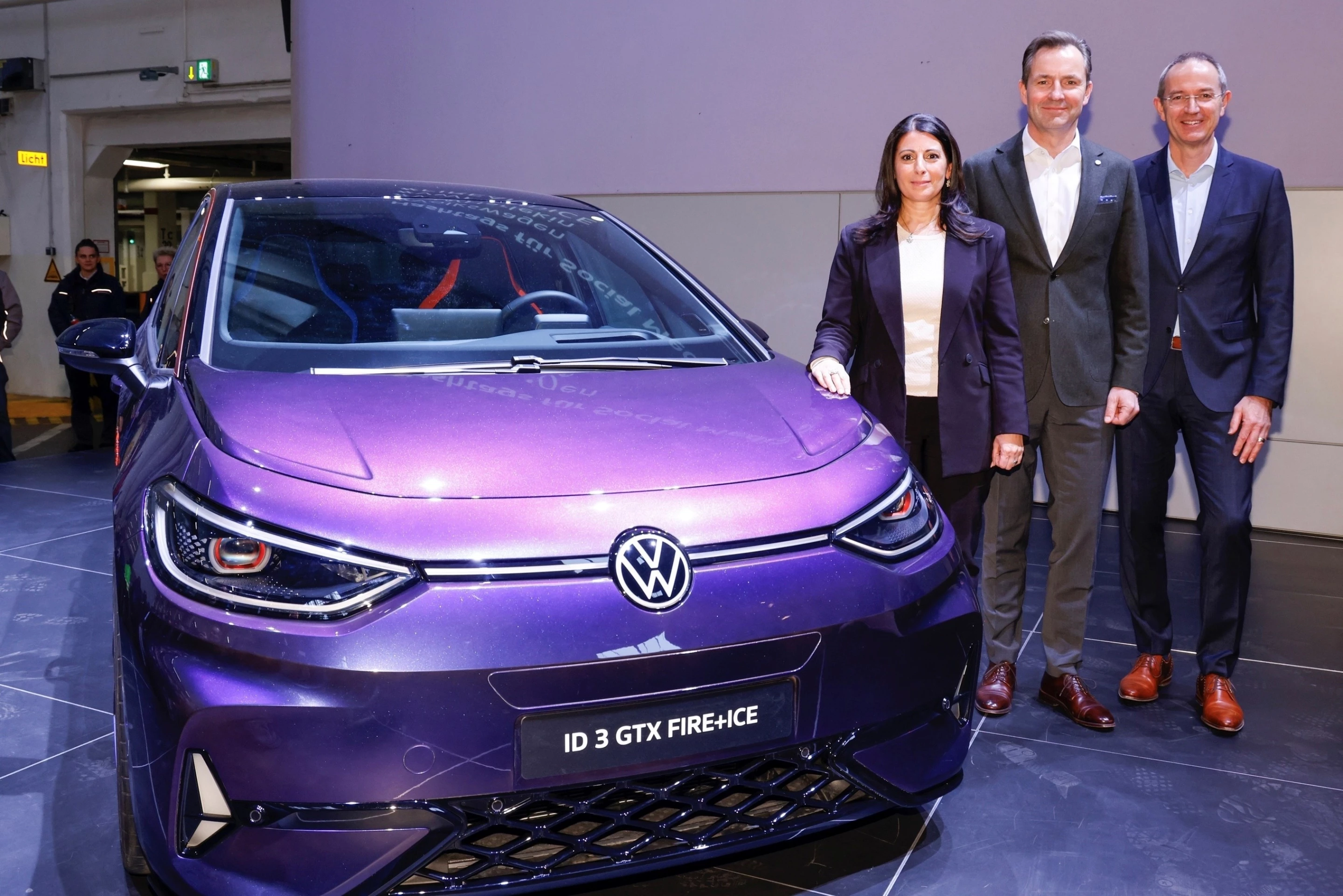 Posing with the ID.3 GTX Fire+Ice special edition, left to right, Daniela Cavallo (chairwoman of VW AG works council), Thomas Schäfer (VW CEO for passenger cars), and Uwe Schwartz (Wolfsburg plant manager) all spoke at the works meeting on February 5, 2025 in Wolfsburg