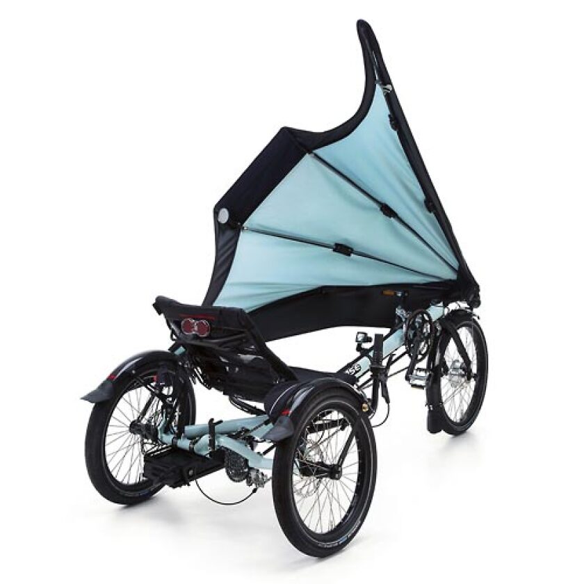 Hase Bikes' KLIMAX tricycle features a detachable folding fairing, allowing users to add weather protection as needed