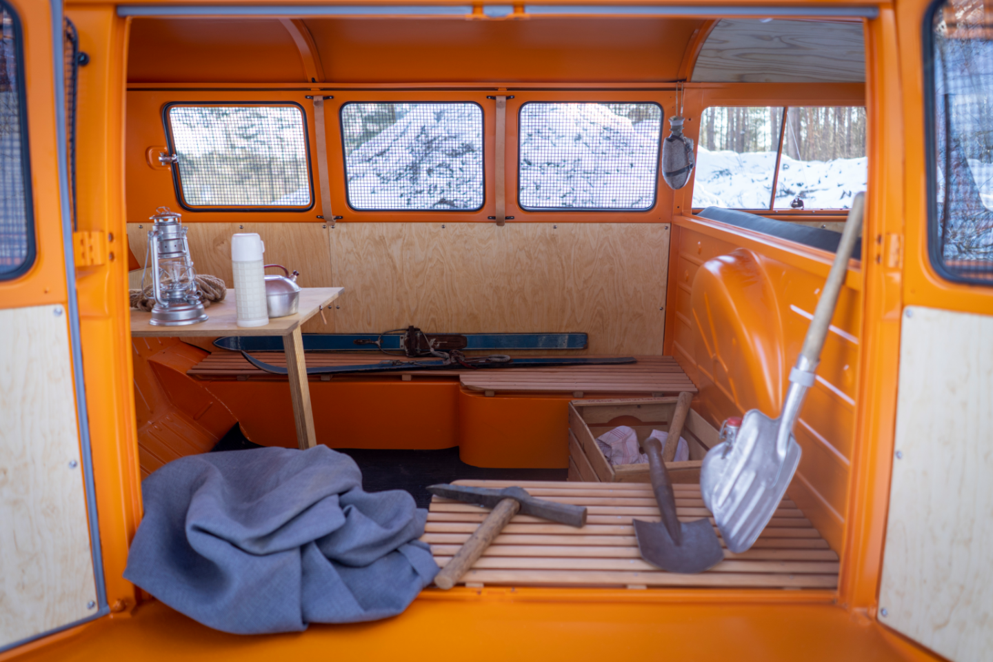 The bench looks perfect for transporting a group of skiers; the table looks out of a VW camper; and the work tools remind us of the Half-track Fox's utility