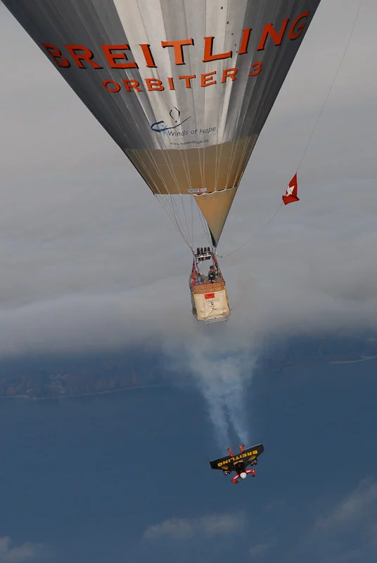 Swiss 'Jetman' Yves Rossy has successfully performed two aerial loops, using his unique strap-on jet-powered wing