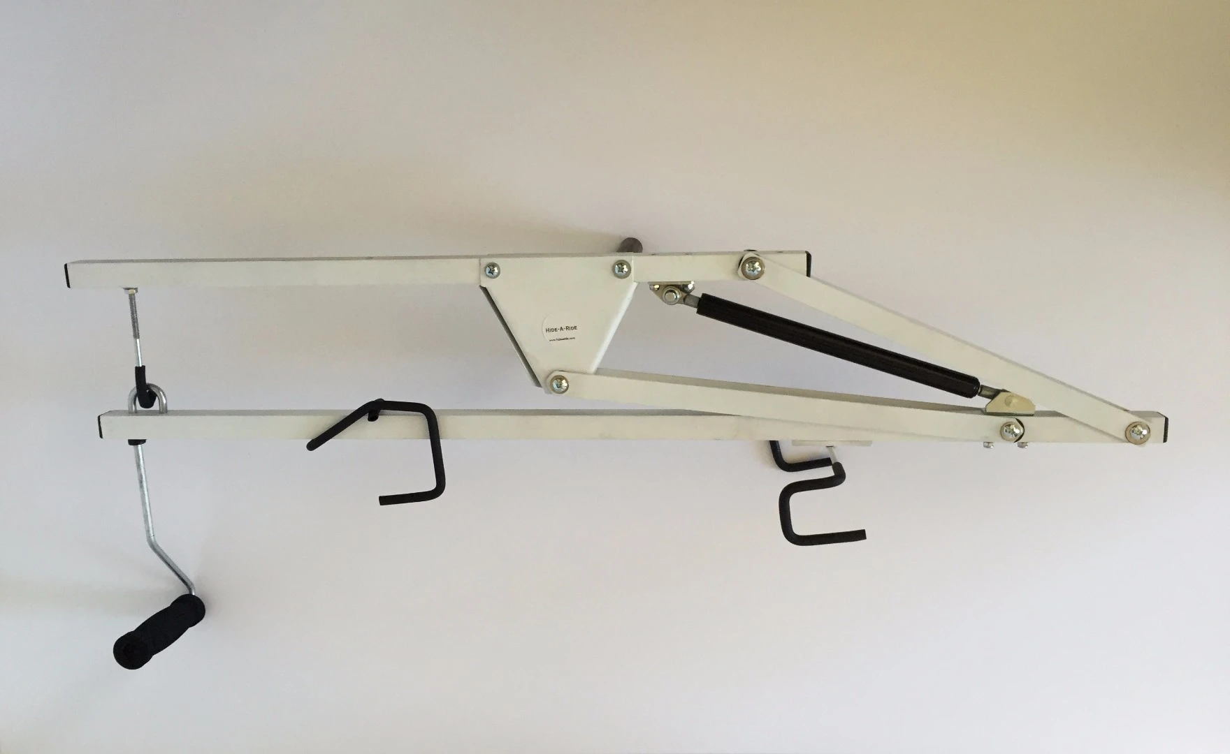 Crafted from aluminum and cold rolled steel, the 7 lb (3.18 kg) Hide-A-Ride is bolted onto ceiling joists and can be installed in spaces as narrow as a hallway