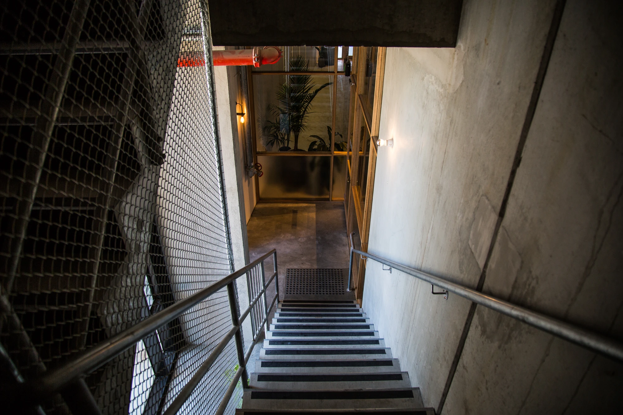 Untouched concrete decorated with measurements scribbled in pencil during construction lines the staircase up to the second floor (Photo: Nick Lavars/Gizmag.com)