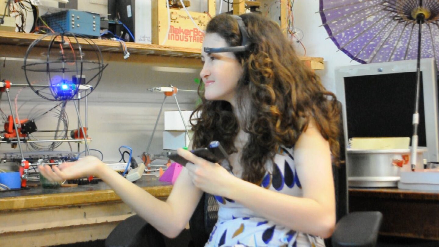 An EEG headset communicates with the mobile device via Bluetooth, software analyzes the incoming brainwave data and transmits command signals to the helicopter via an IR adapter plugged into the audio jack