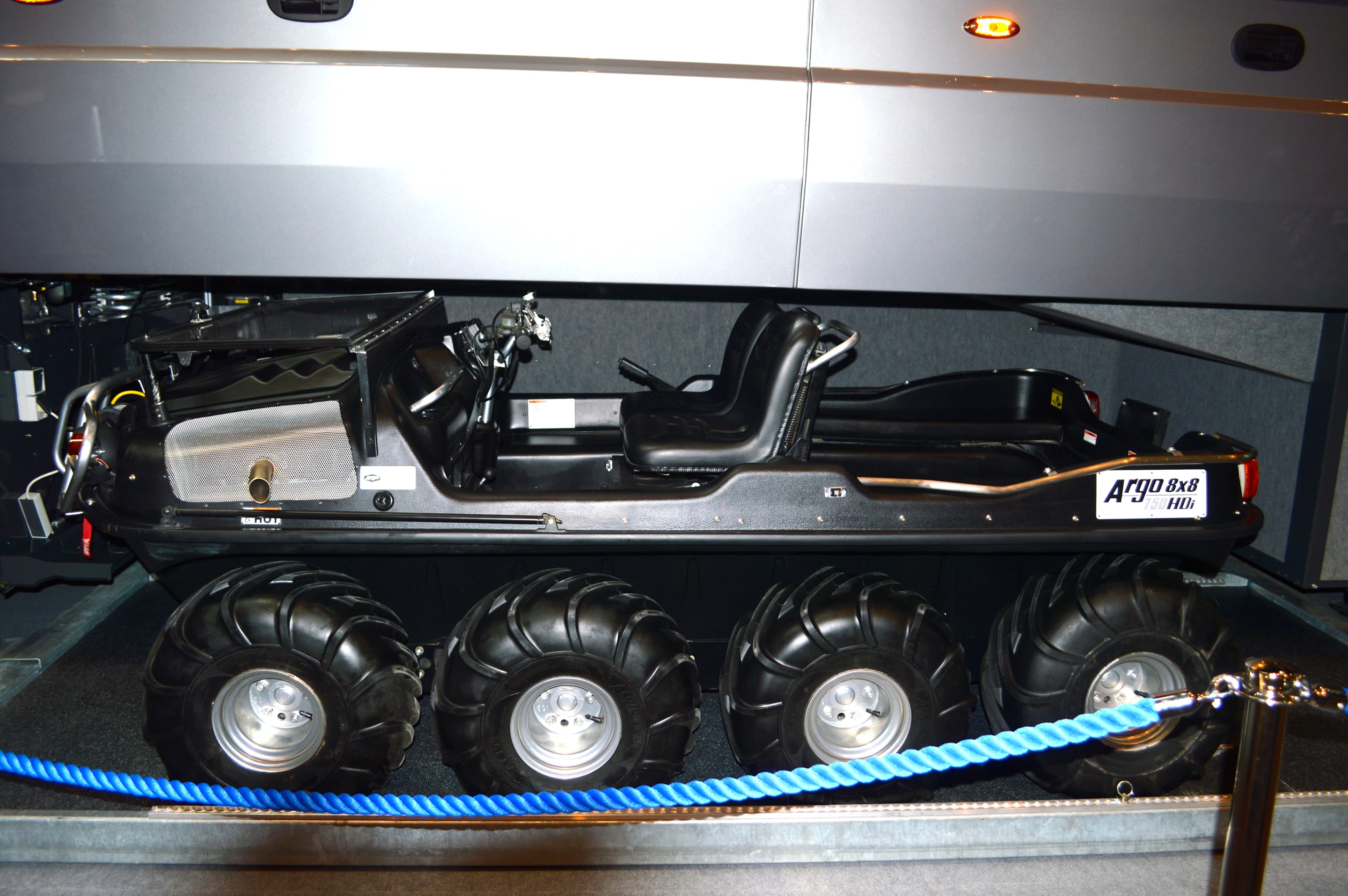 The ARGO 8x8 750 HDi, shown tucked inside a Volkner Mobil RV at the 2013 Dusseldorf Caravan Salon, serves as the powertrain base for the XTI