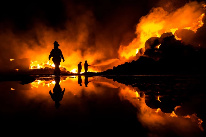 Heroic work of the firefighters of Mexicali Baja California Mexico attending a gigantic fire of a recycling plant fire - 1st place winner in the National Awards for Mexico