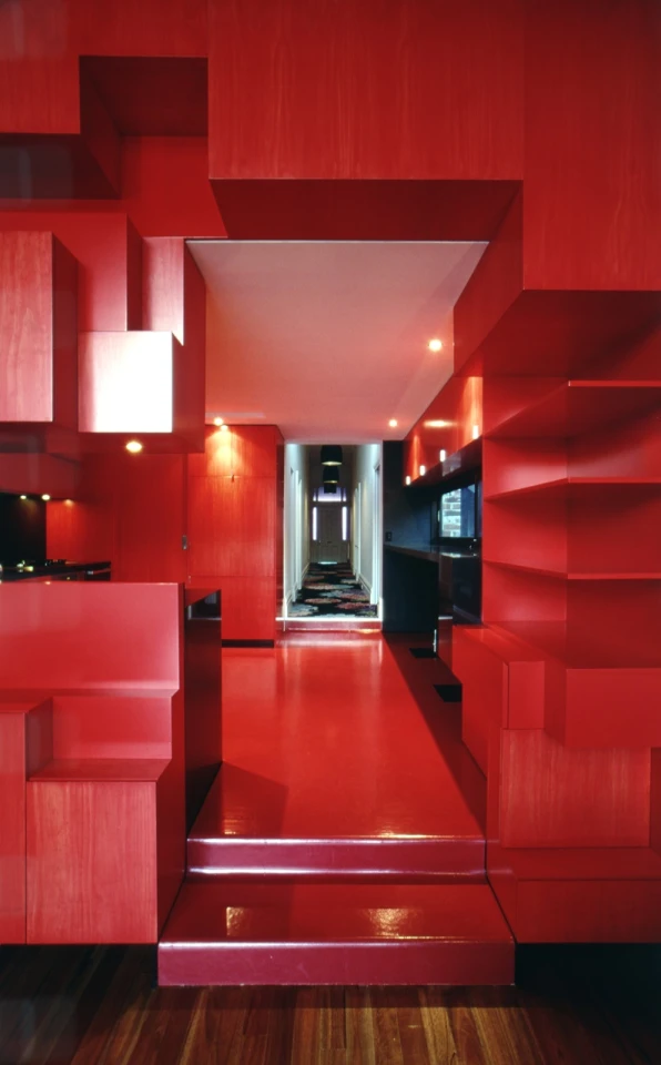 Nested within the cloud-shaped extension is a red cube: the Cloud House's new kitchen