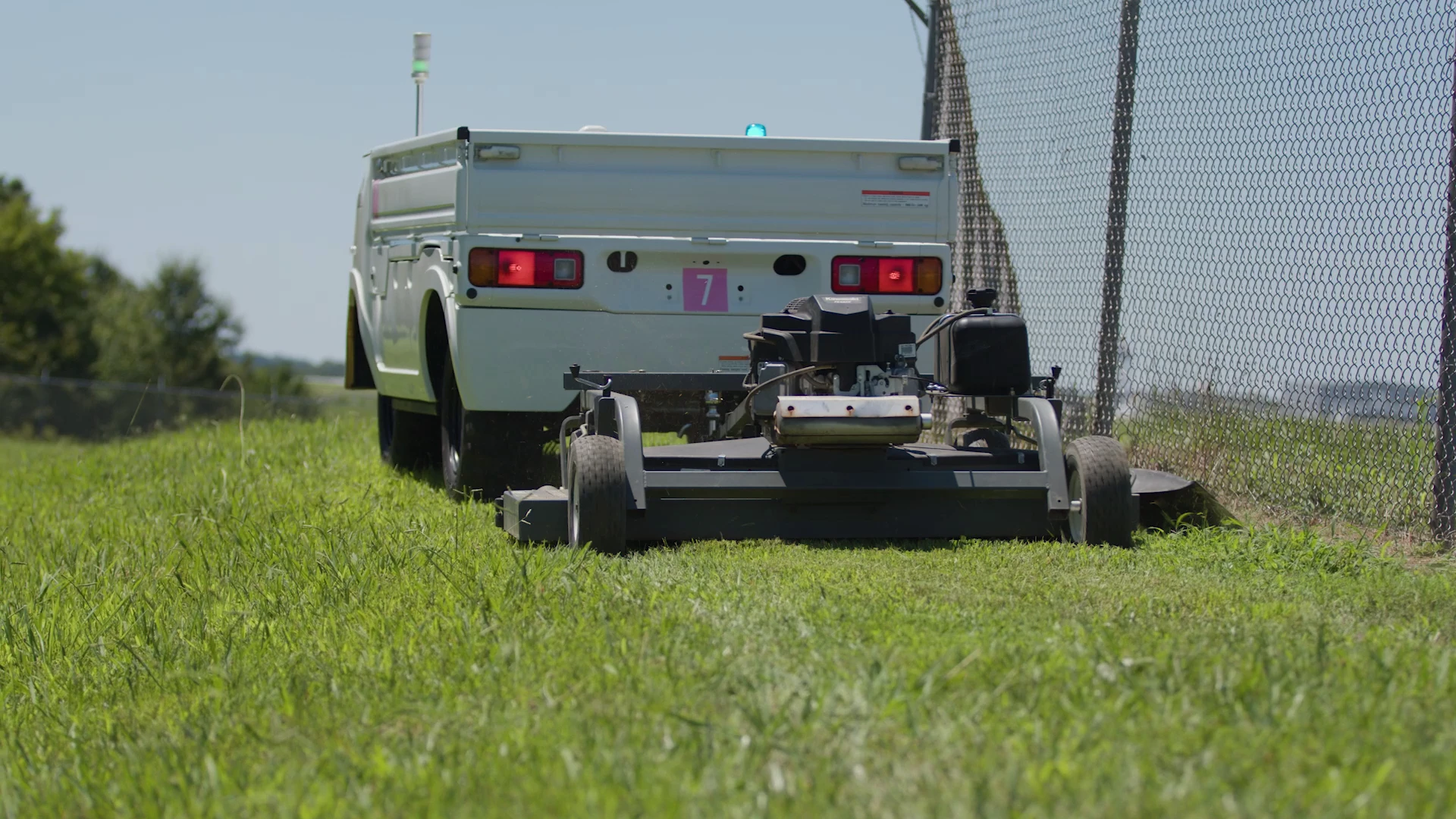 The Autonomous Work Vehicle could help with site maintenance, including mowing the grass