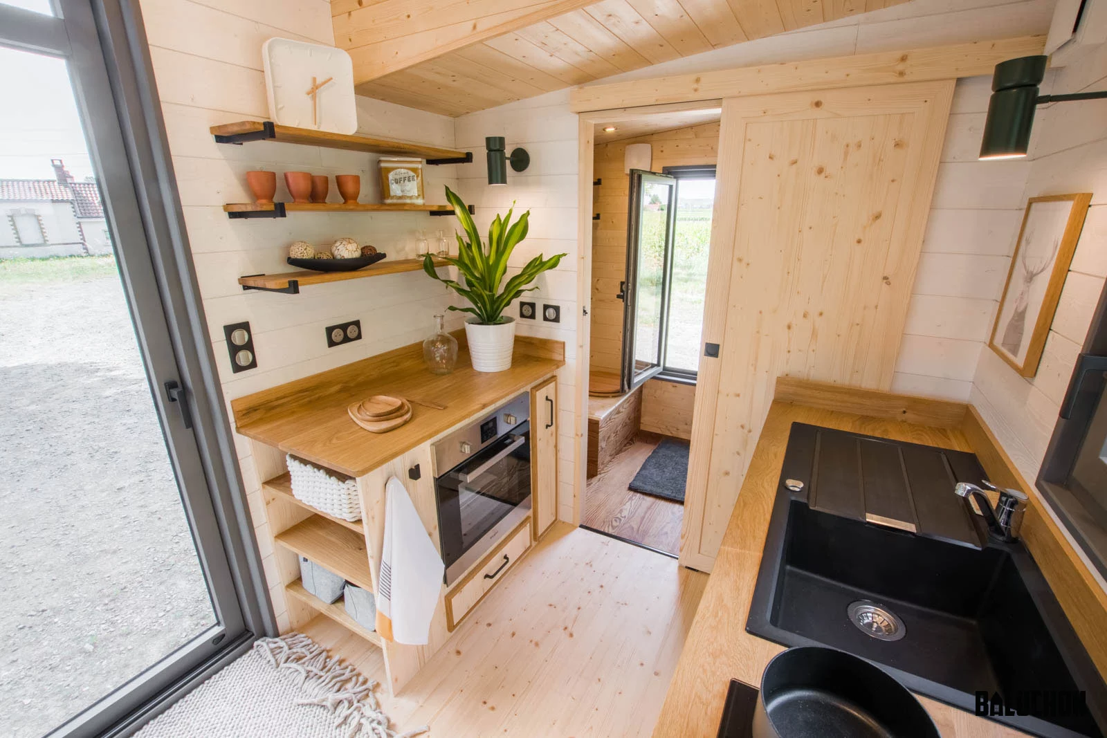 The Eucalyptus' bathroom is reached by sliding door from the kitchen