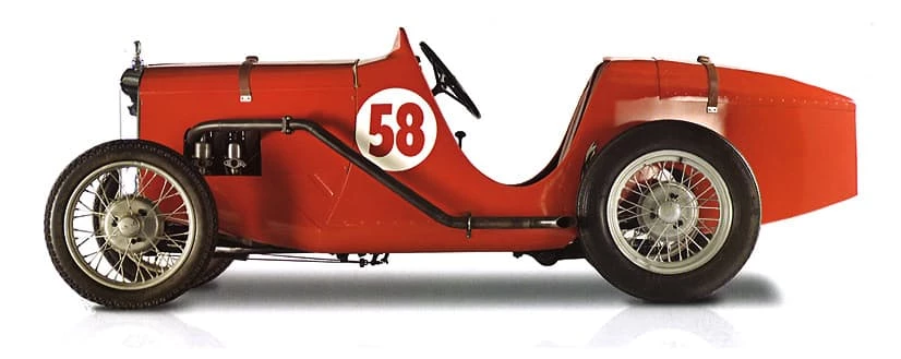 The tiny Austin 7 is the first car on the boulevard at MTC