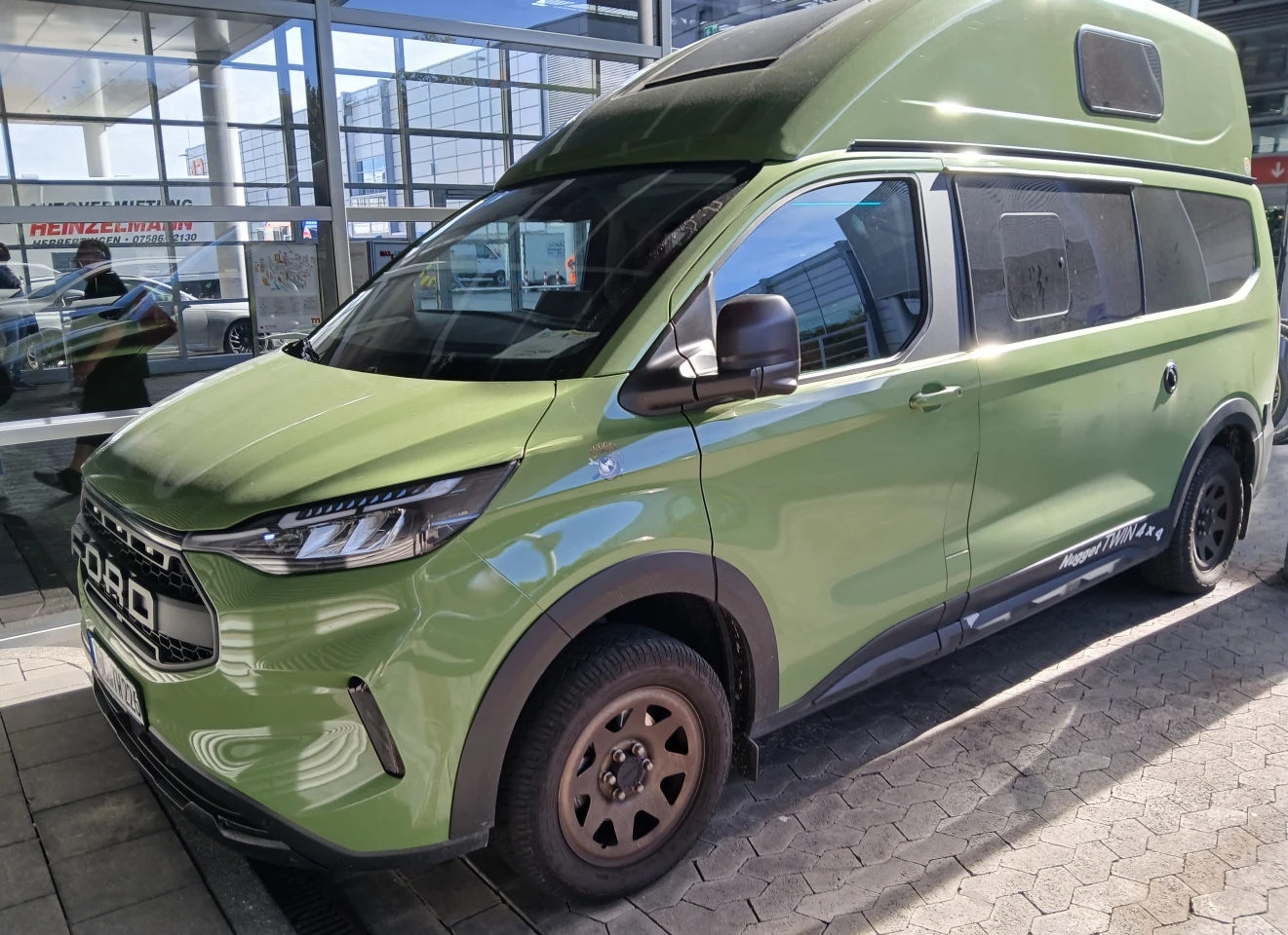 We were walking between halls down that window-covered corridor in back when we spotted another Nugget Twin worth checking out, this one just parked quietly in a small lot outside