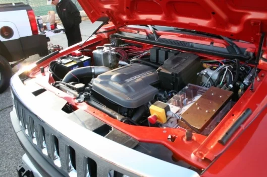 Raser Technologies has debuted a Hummer H3 converted into a plug-in series hybrid to coincide with the company's listing on the New York Stock Exchange