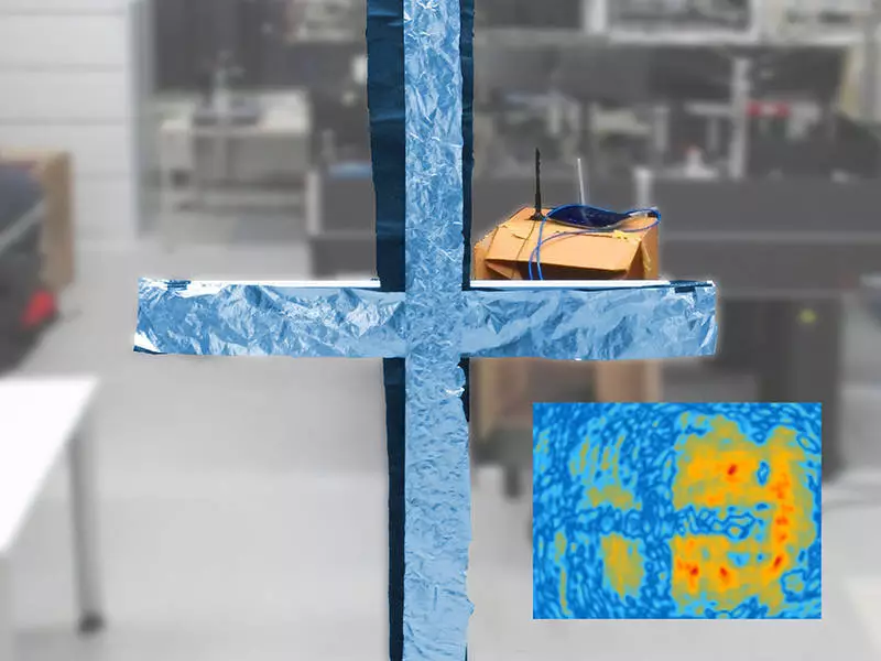 A cross made of aluminum foil between the viewer and the Wi-FI router can easily be reconstructed from the Wi-Fi hologram as can be seen in the inserted picture