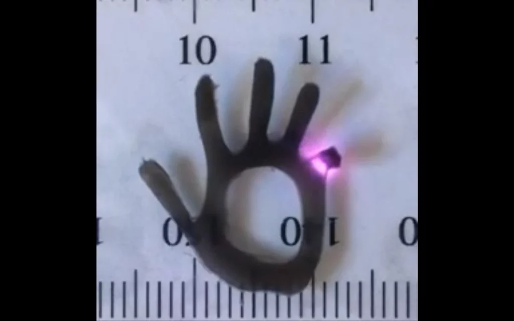 A finger on the hydrogel hand bends in response to near-infrared laser light