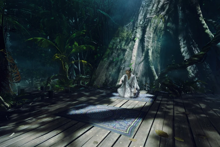 The VR experience begins with the participant sitting on a rug, deep in the Amazon jungle, in front of an old, stereotypical shaman